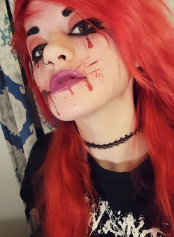 Orange, bright red hair color, special effects makeup, blood splatters and stains, nose ring, black eyeliner, choker, Dying Wish t-shirt, selfie