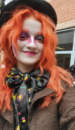 Orange hair, Mad Hatter costume, handmade from used second-hand materials.